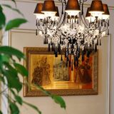 Pair of chandeliers in lacquered metal and faceted pearls