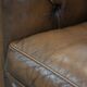 Brown cowhide leather chesterfield armchair  in English style on wheels