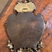 Mirror in the Louis XV Rocaille style in gilded bronze.