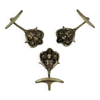 Trio of brass coat hooks
