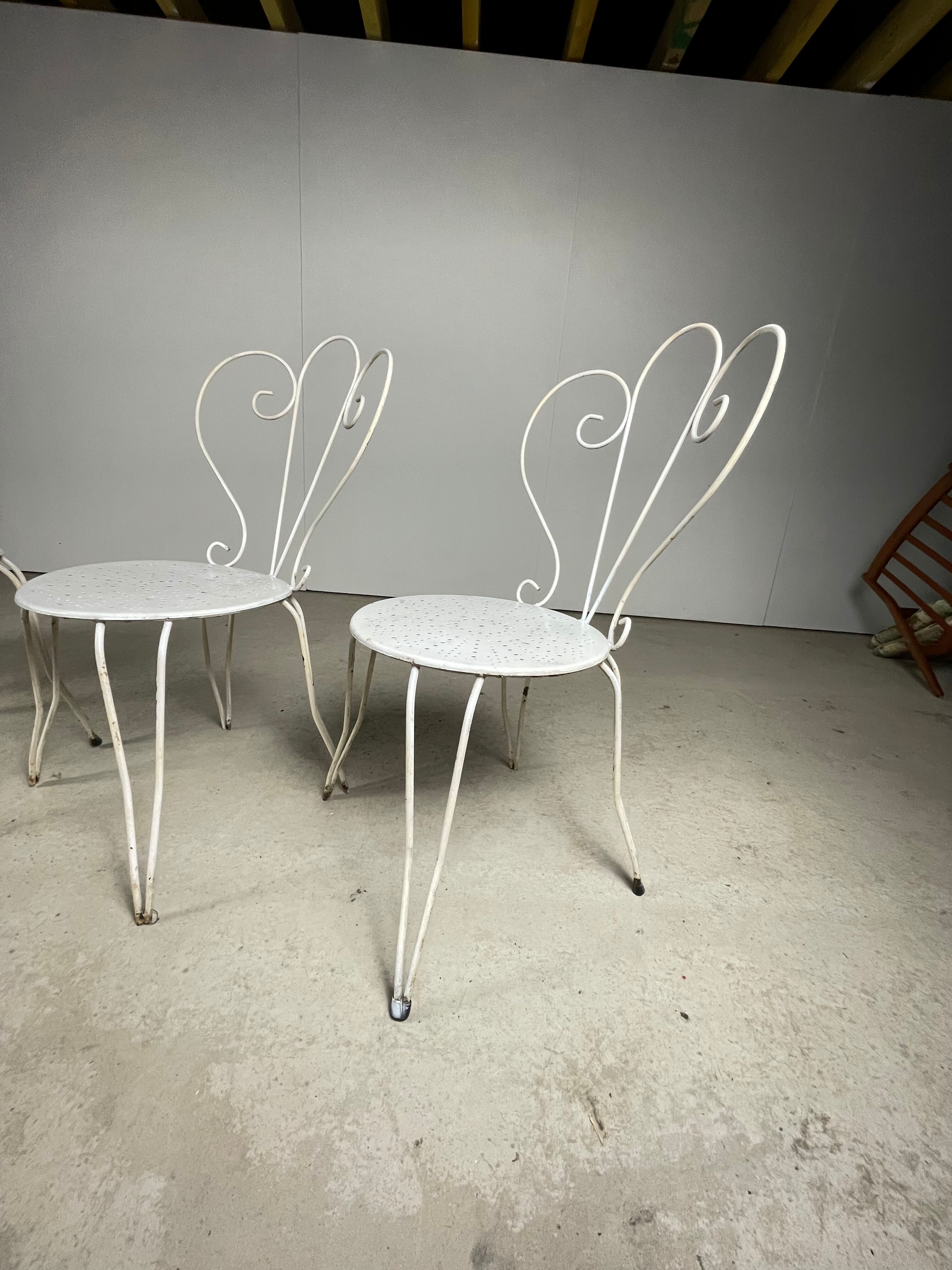 4 vintage wrought iron chairs