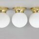 Set of three mid-century brass and milk glass ceiling ligts, restored
