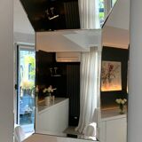 Asymmetrical beveled mirror