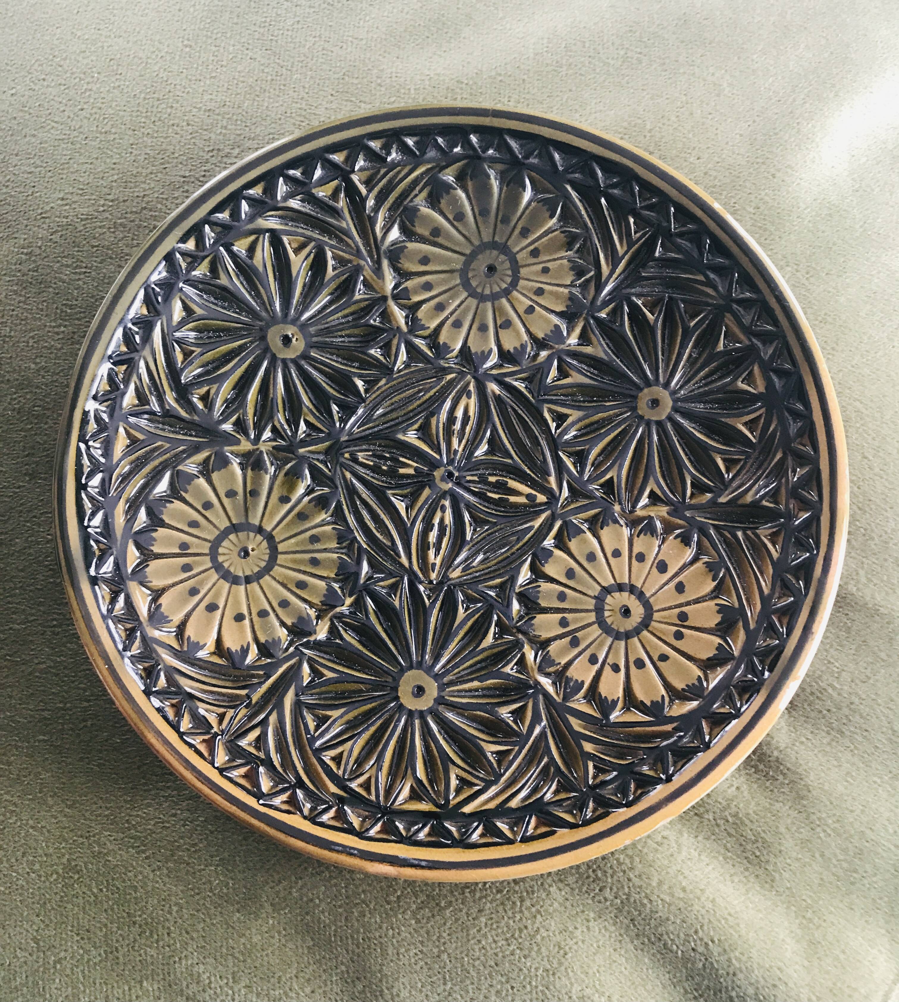 Small decorative chiseled ceramic plate