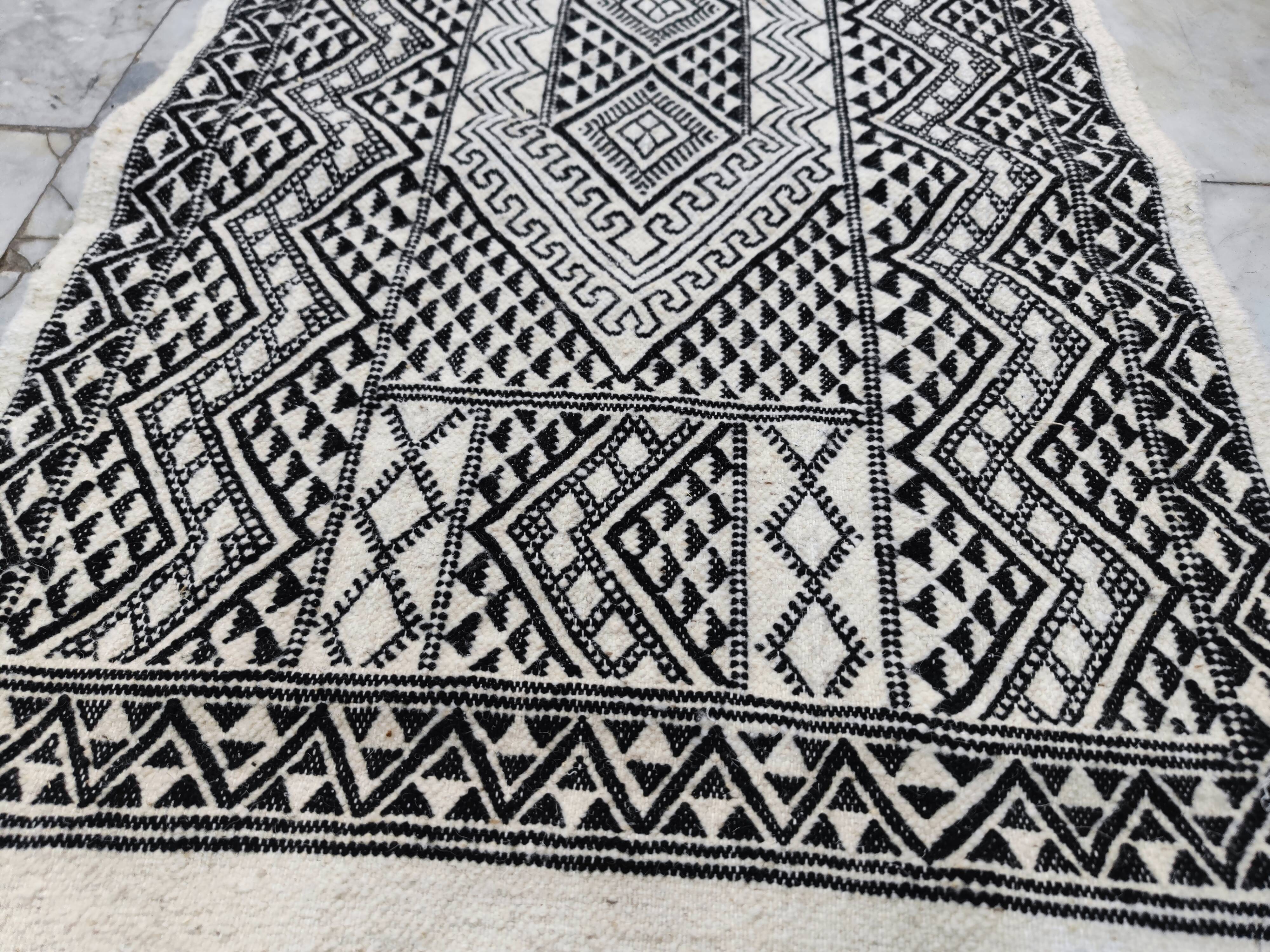 Handwoven black and white rug