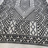Handwoven black and white rug