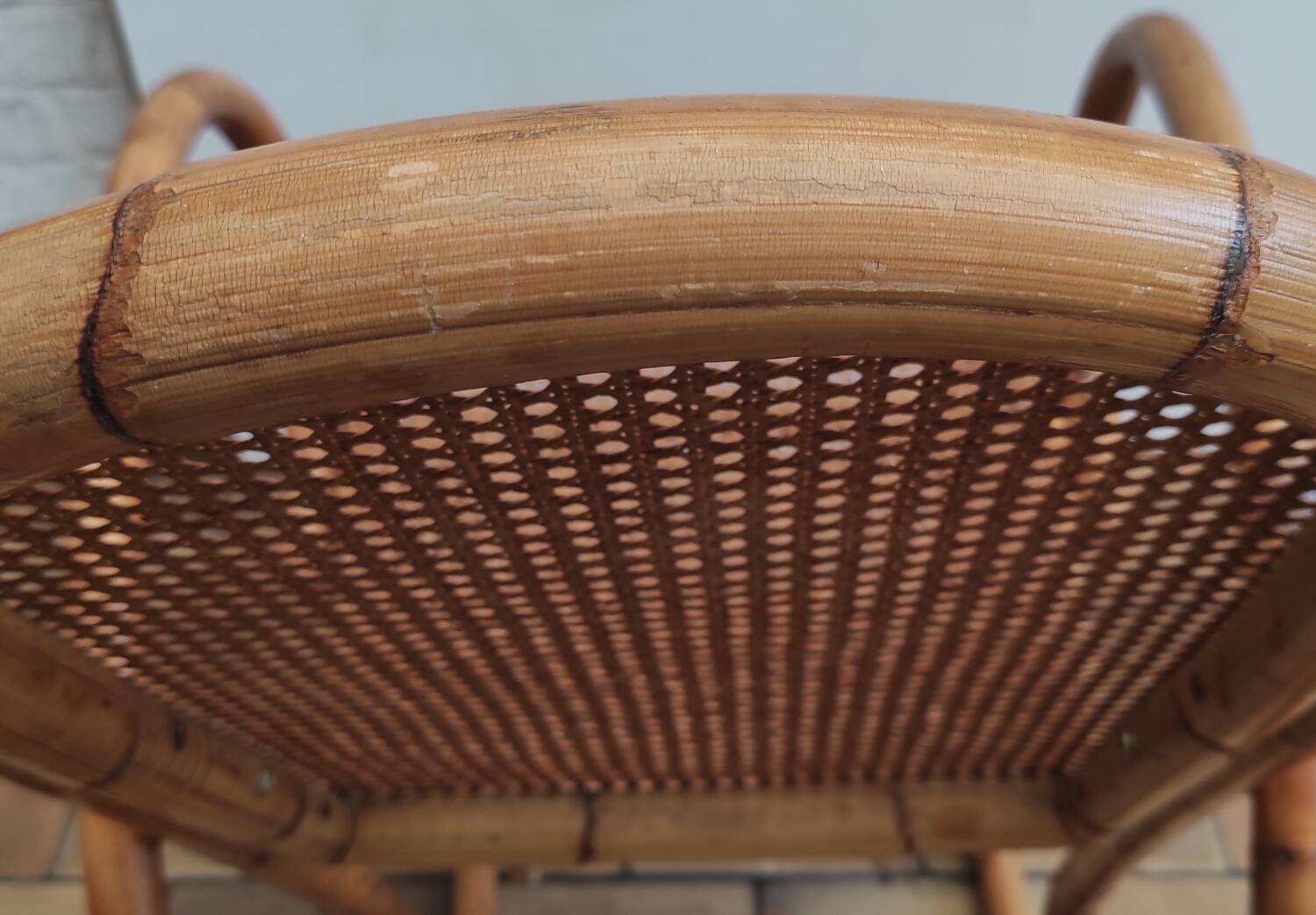 Vintage rocking chair in rattan and cane.