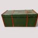 Vintage wooden and metal green travel trunk, circa 1930.