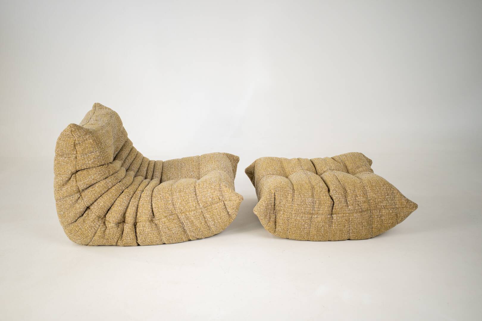 Togo set of launge chair and pouf in caramel loop
