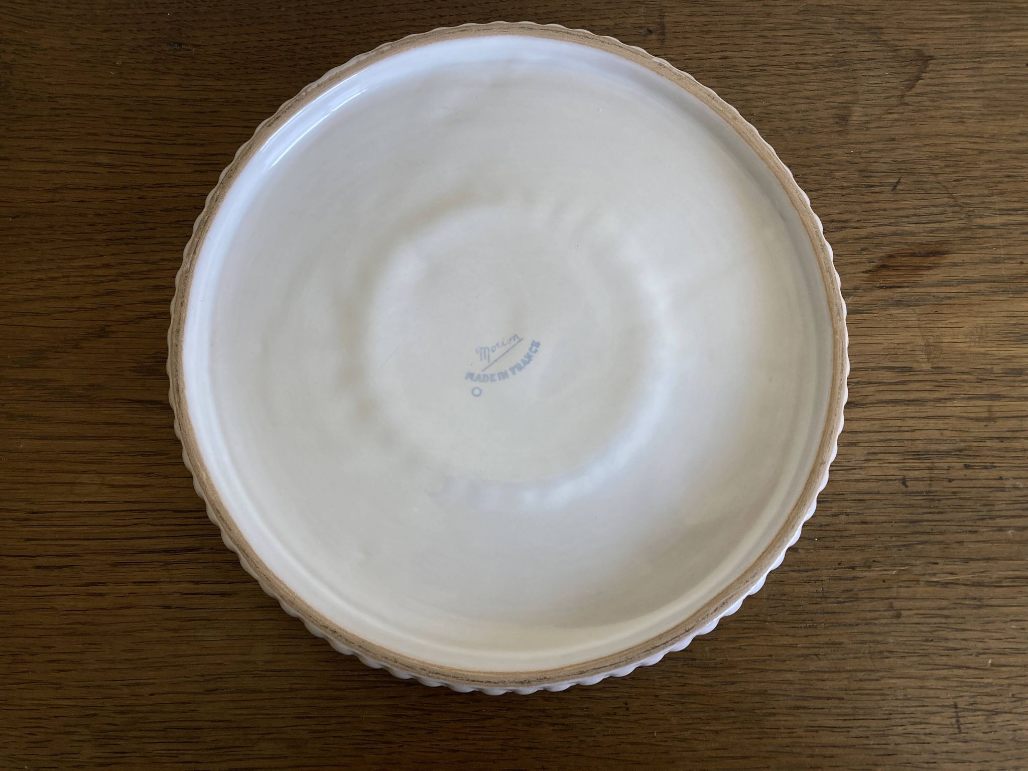 Pierre Motton glazed earthenware scalloped trivet for Gien