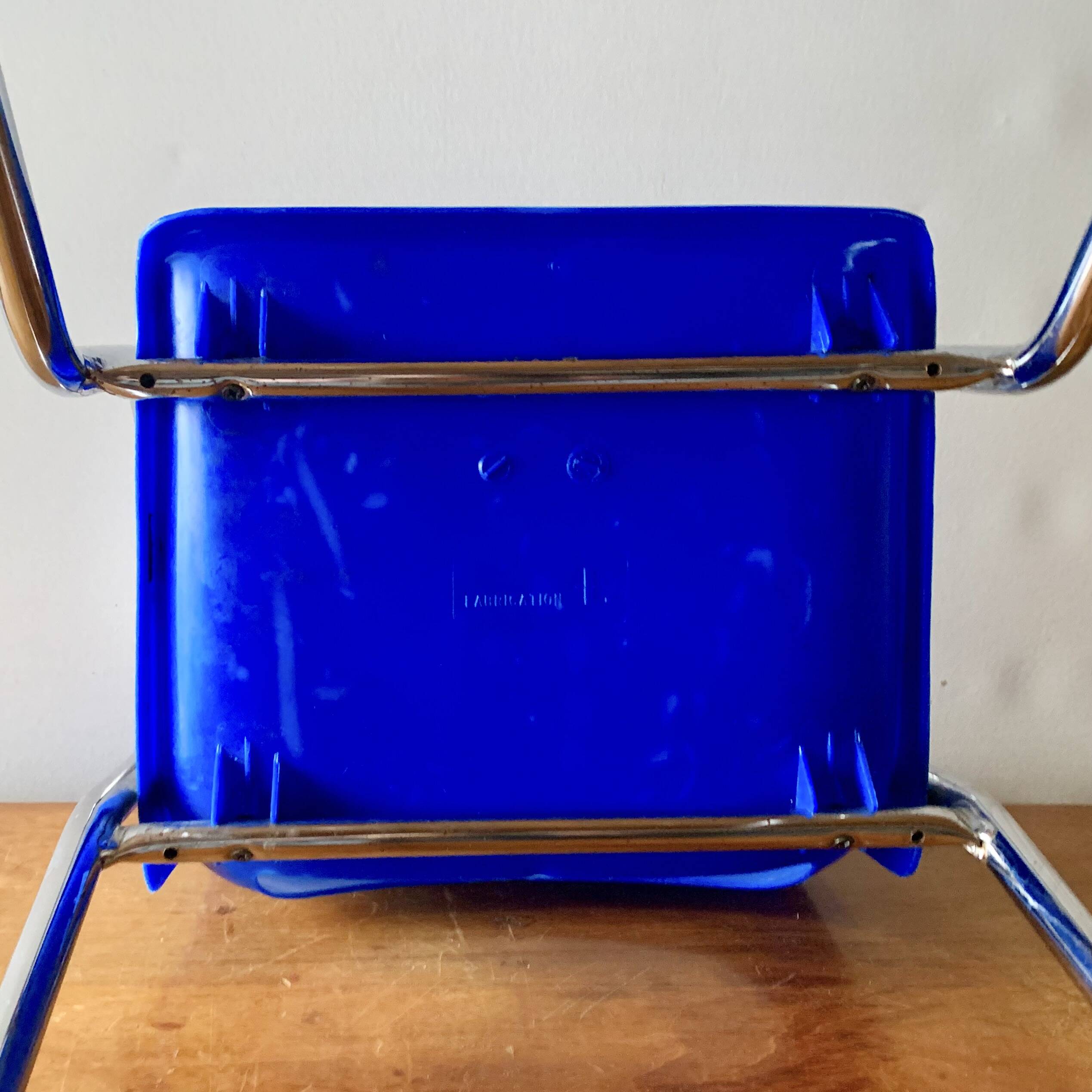 Vintage high chair for children in chrome metal and blue plastic