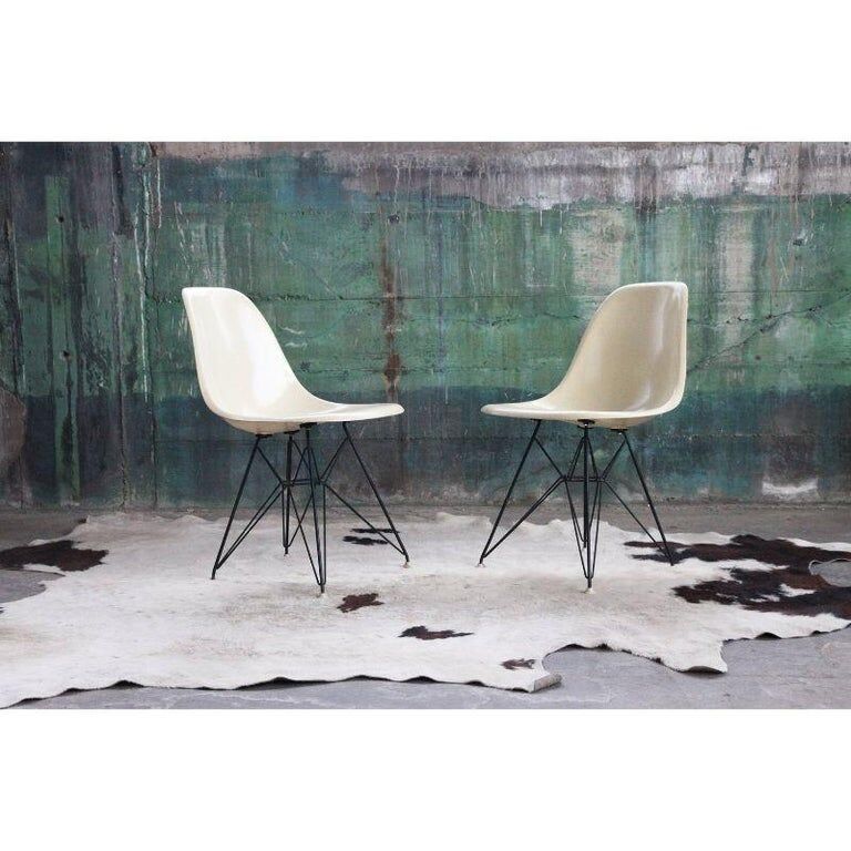 Pair of vintage Charles Eames eggshell and fiberglass chairs