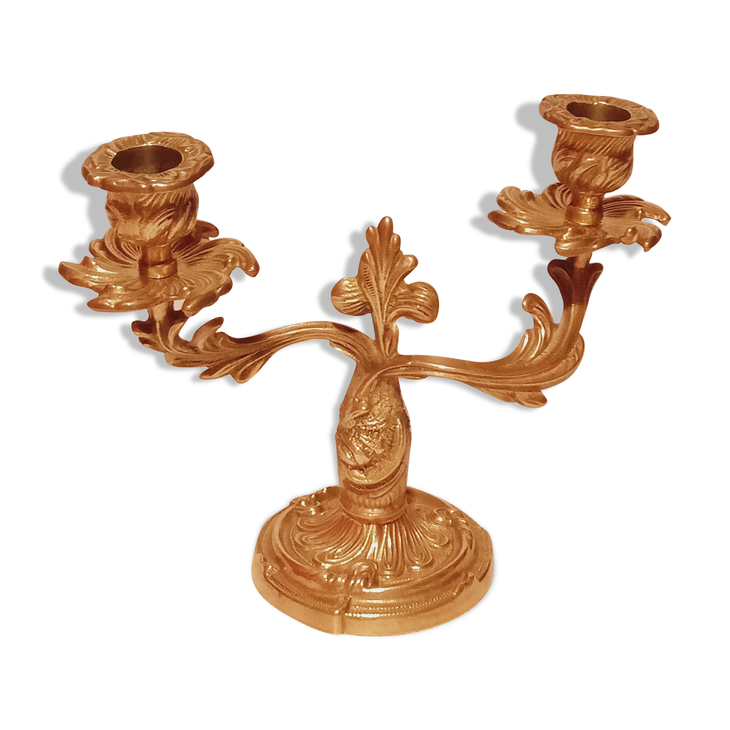 Old candle holder in gilded bronze