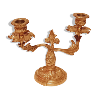 Old candle holder in gilded bronze