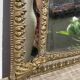 Miroir dorée à parcloses en laiton repoussé XIXème