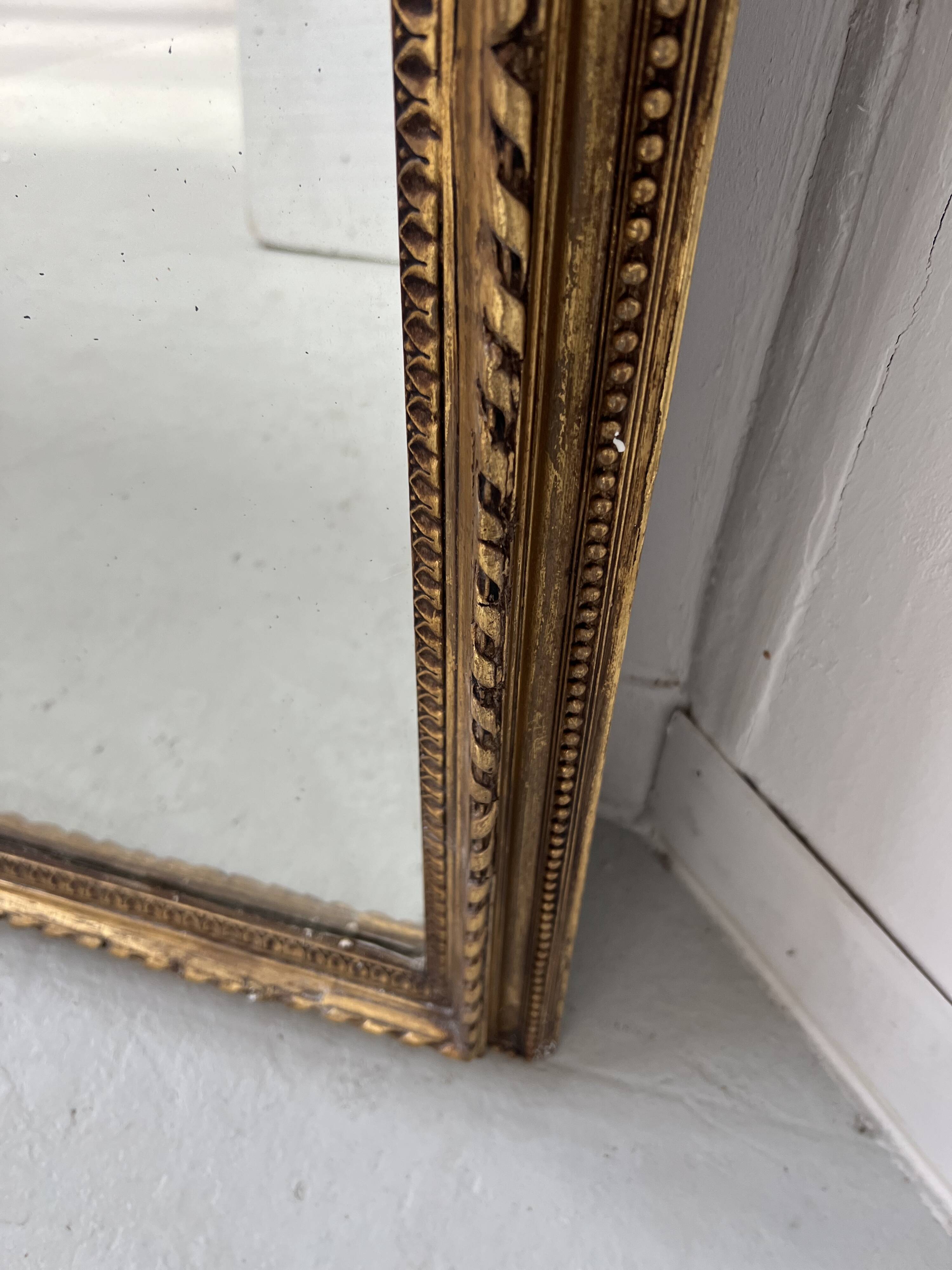Louis XVI style mirror in wood and gilded stucco, 19th century