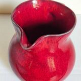 Vintage red enamel ceramic pitcher