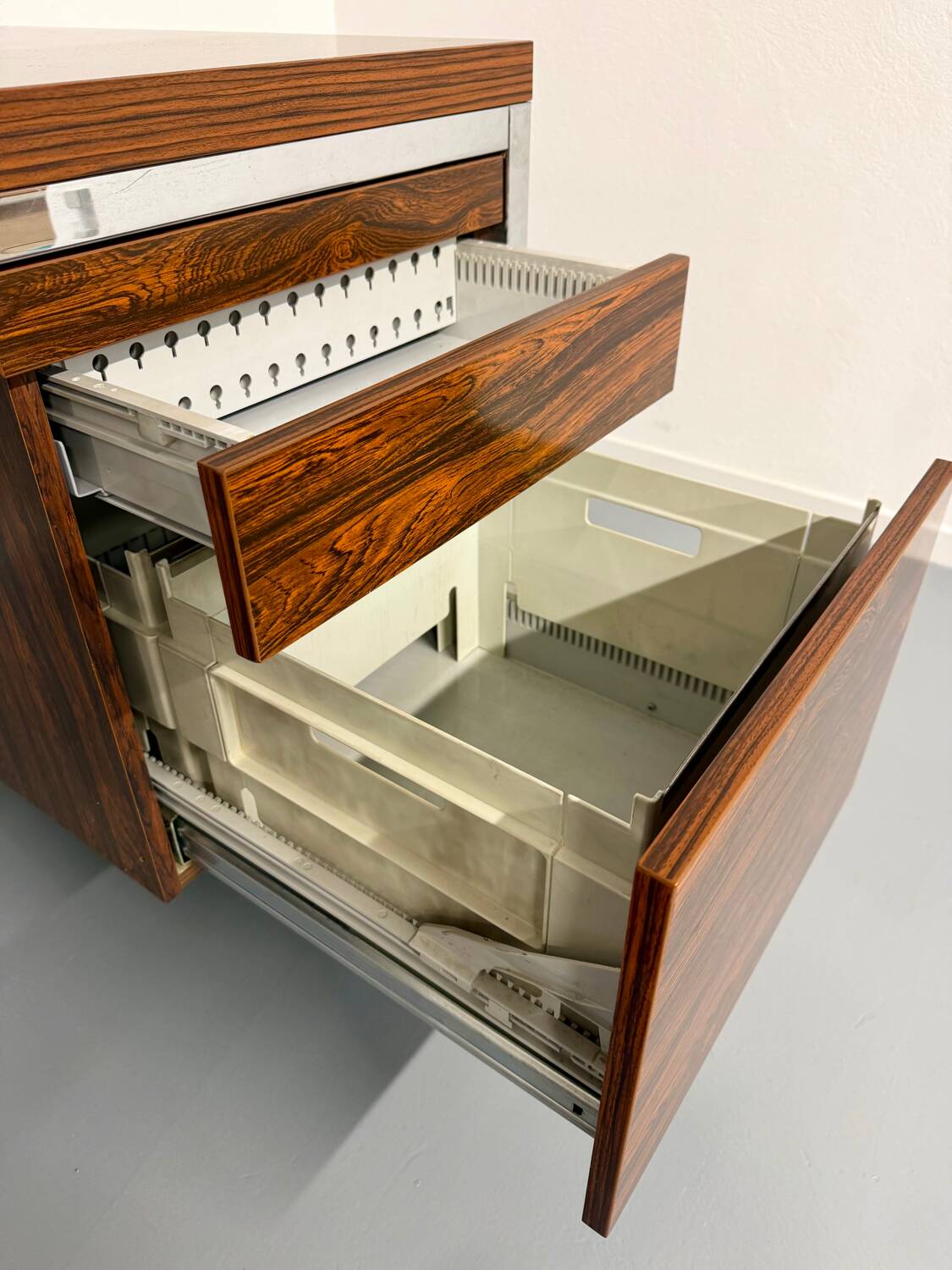 Vintage desk with rosewood veneer and chrome metal design from the 1970s.