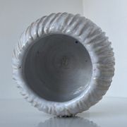 Meeting of three artist's ceramic objects including two pots and a cream covered bowl