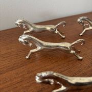 Set of 6 vintage galloping horse knife rests in silver-plated metal.
