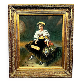Portrait d'une bouquetière dans un beau cadre baguette.