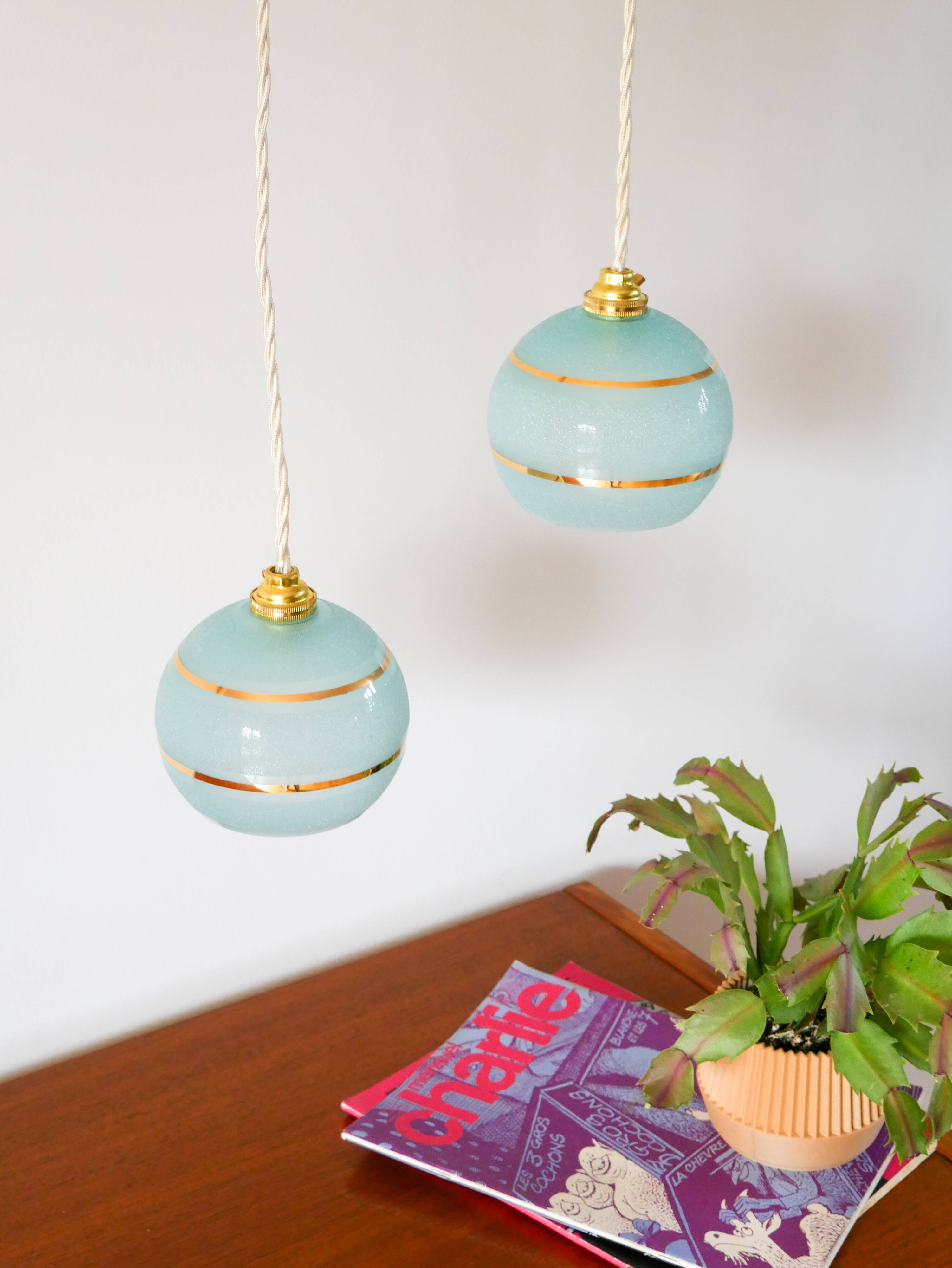 pair of blue and gold granite ball pendants 1950