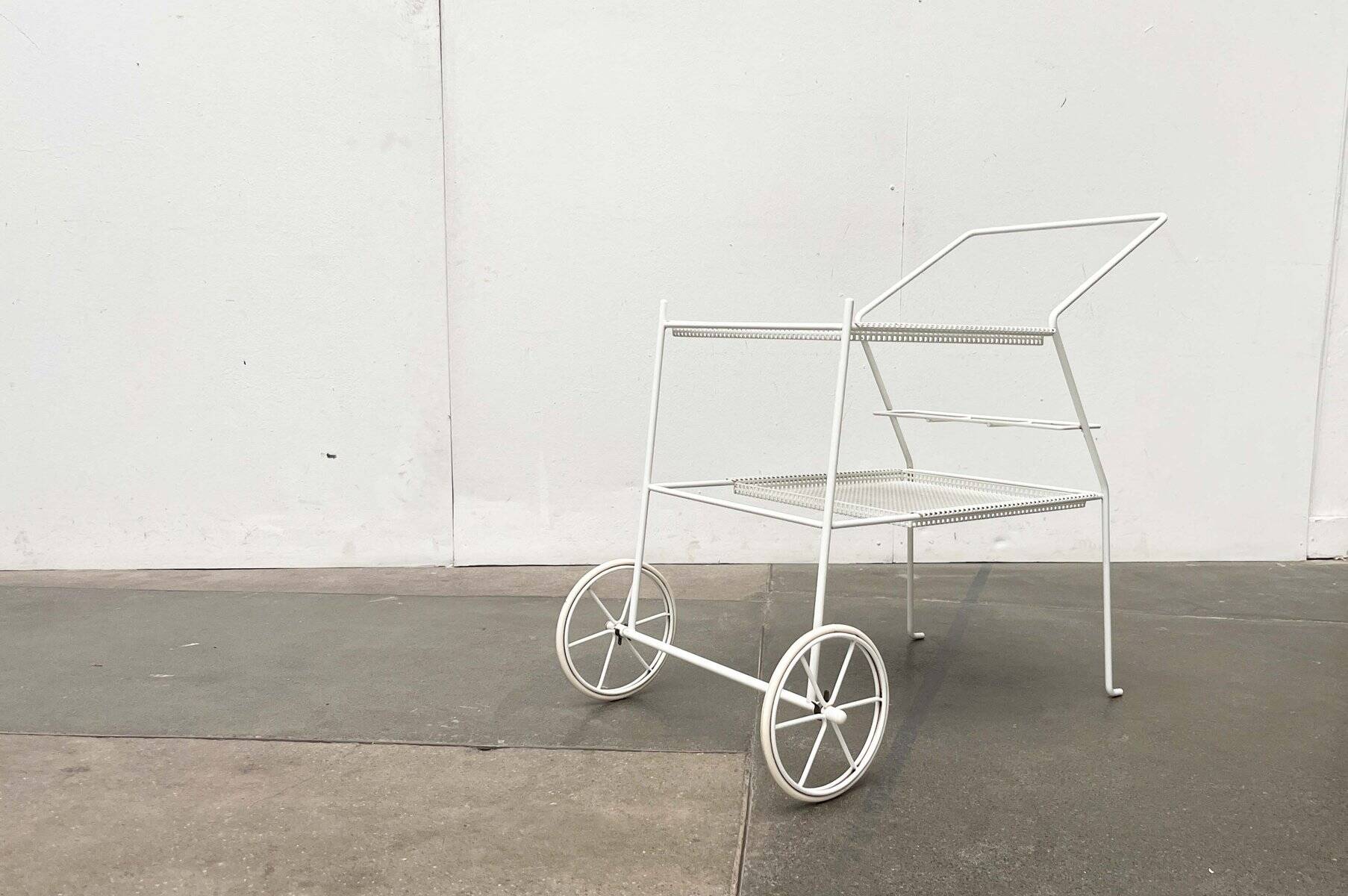 Mid-century modern minimalist perforated metal bar cart from the 1960s.