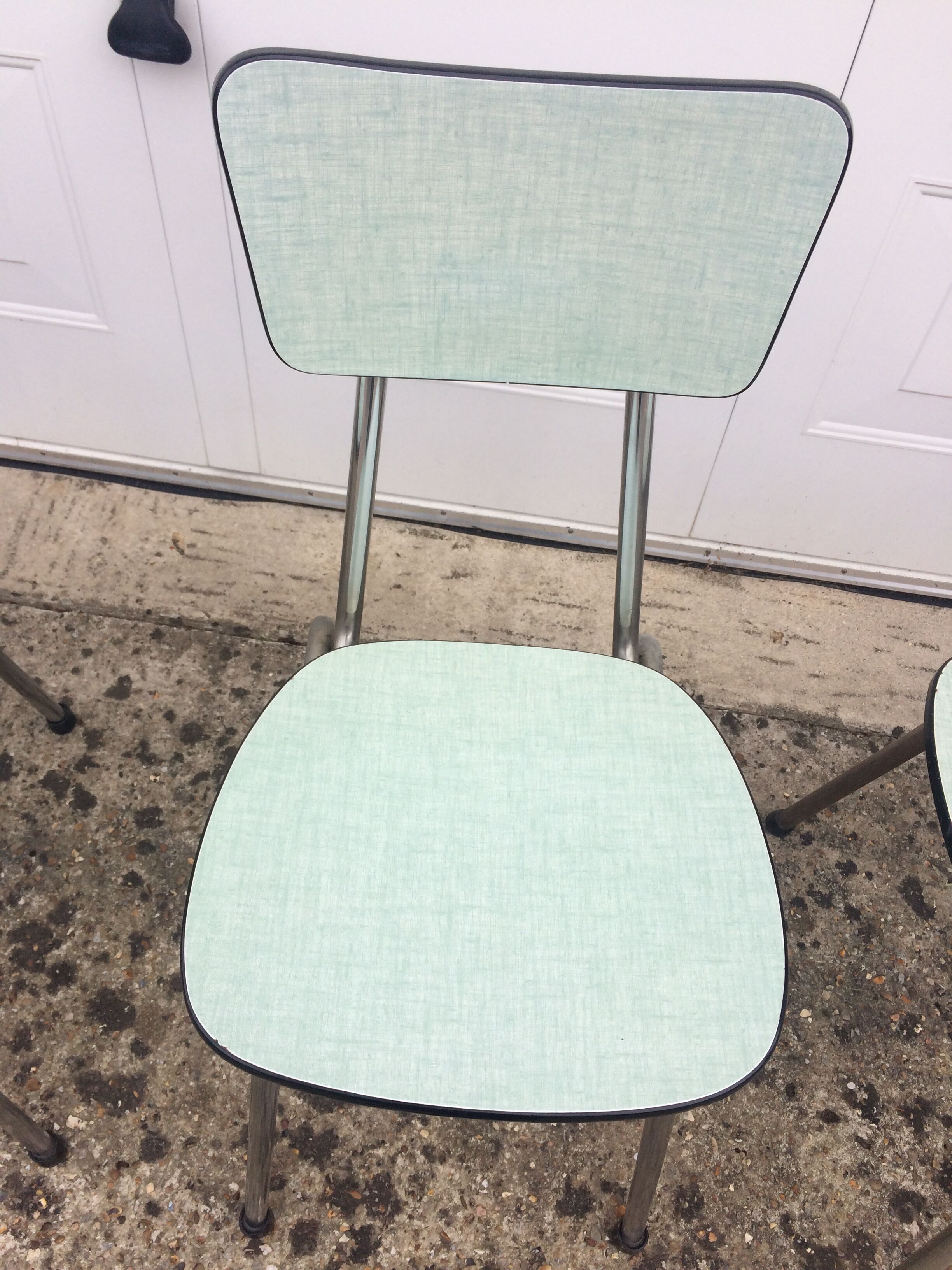 4 green formica chairs
