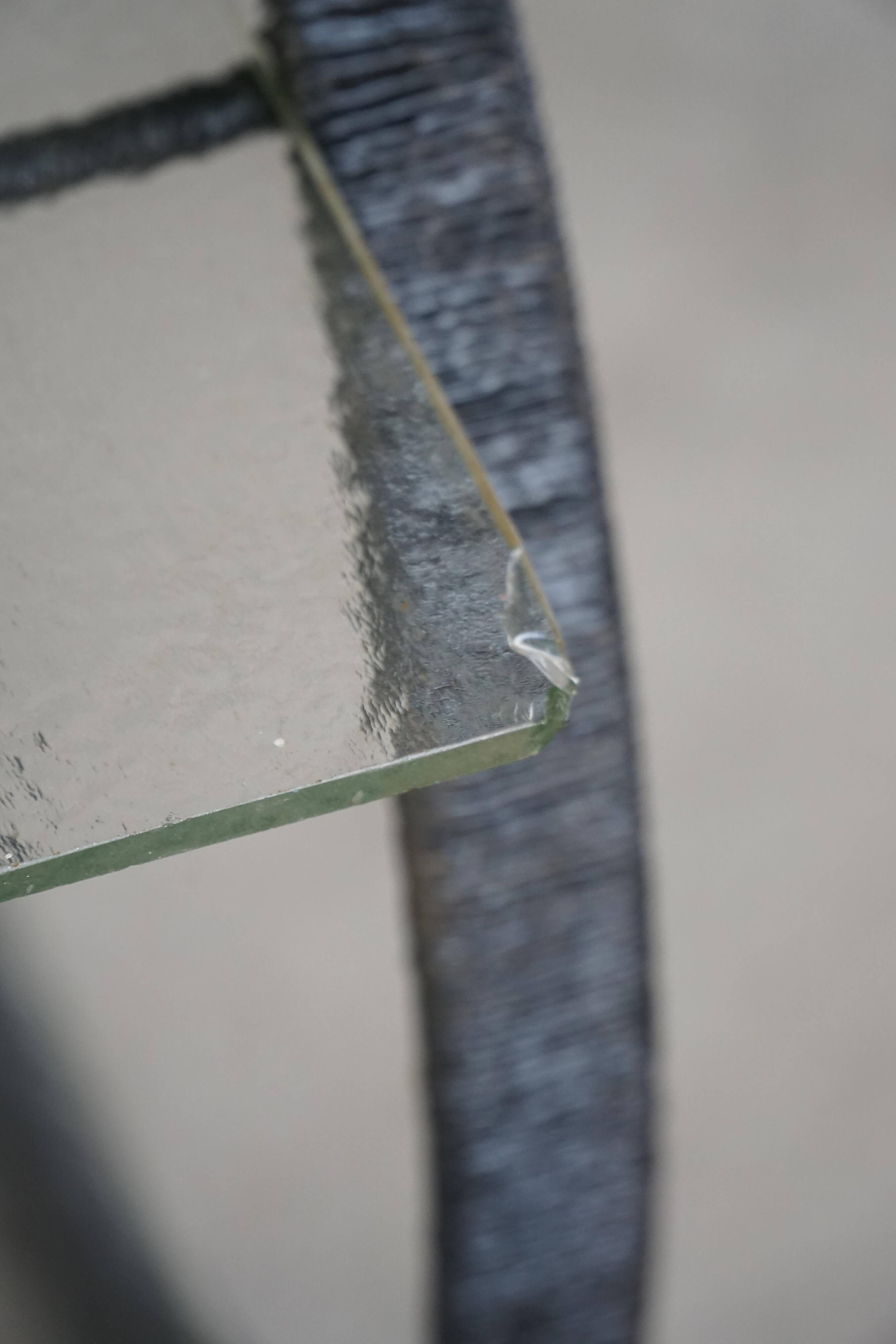 Decorative shelf unit, round metal frames with curved legs and glass shelves, 1960.