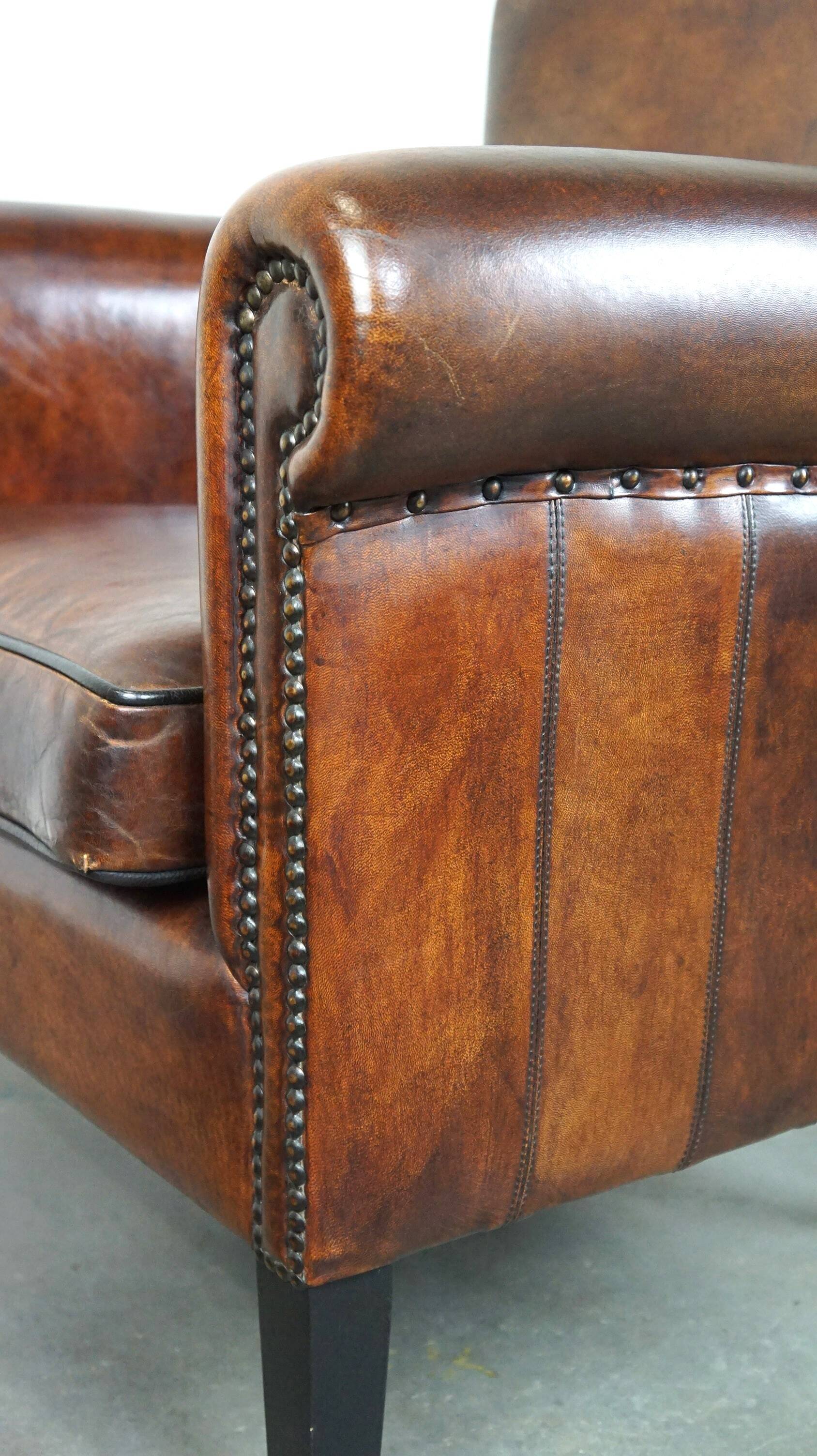 Stylish sheepskin leather armchair with a refined appearance