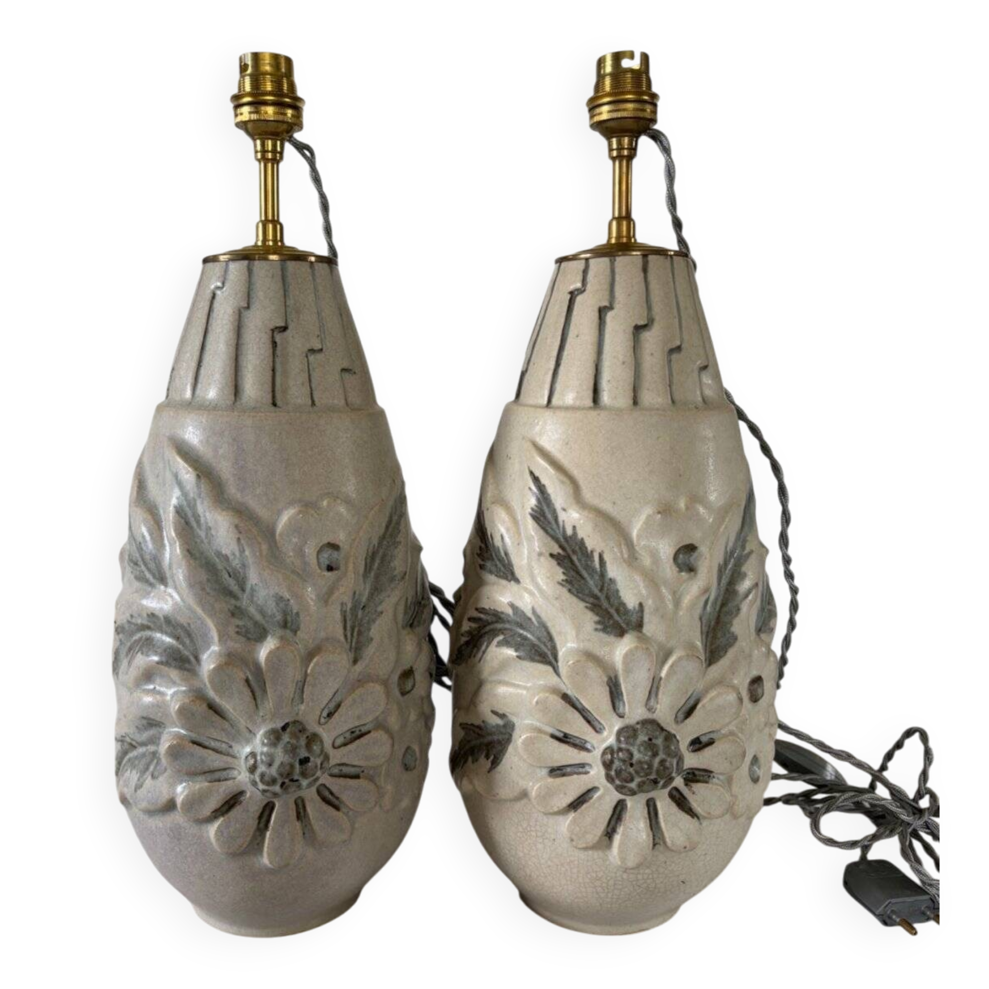 Pair of white glazed stoneware lamp bases, 20th-century floral decoration.