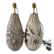 Pair of white glazed stoneware lamp bases, 20th-century floral decoration.