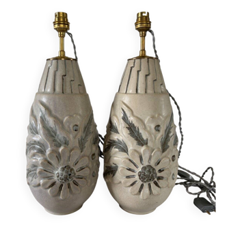 Pair of white glazed stoneware lamp bases, 20th-century floral decoration.