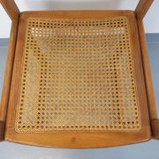 Vintage sleigh chair in beech wood and cane from the 70s and 80s