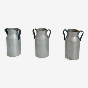 Set of three aluminum milk jugs