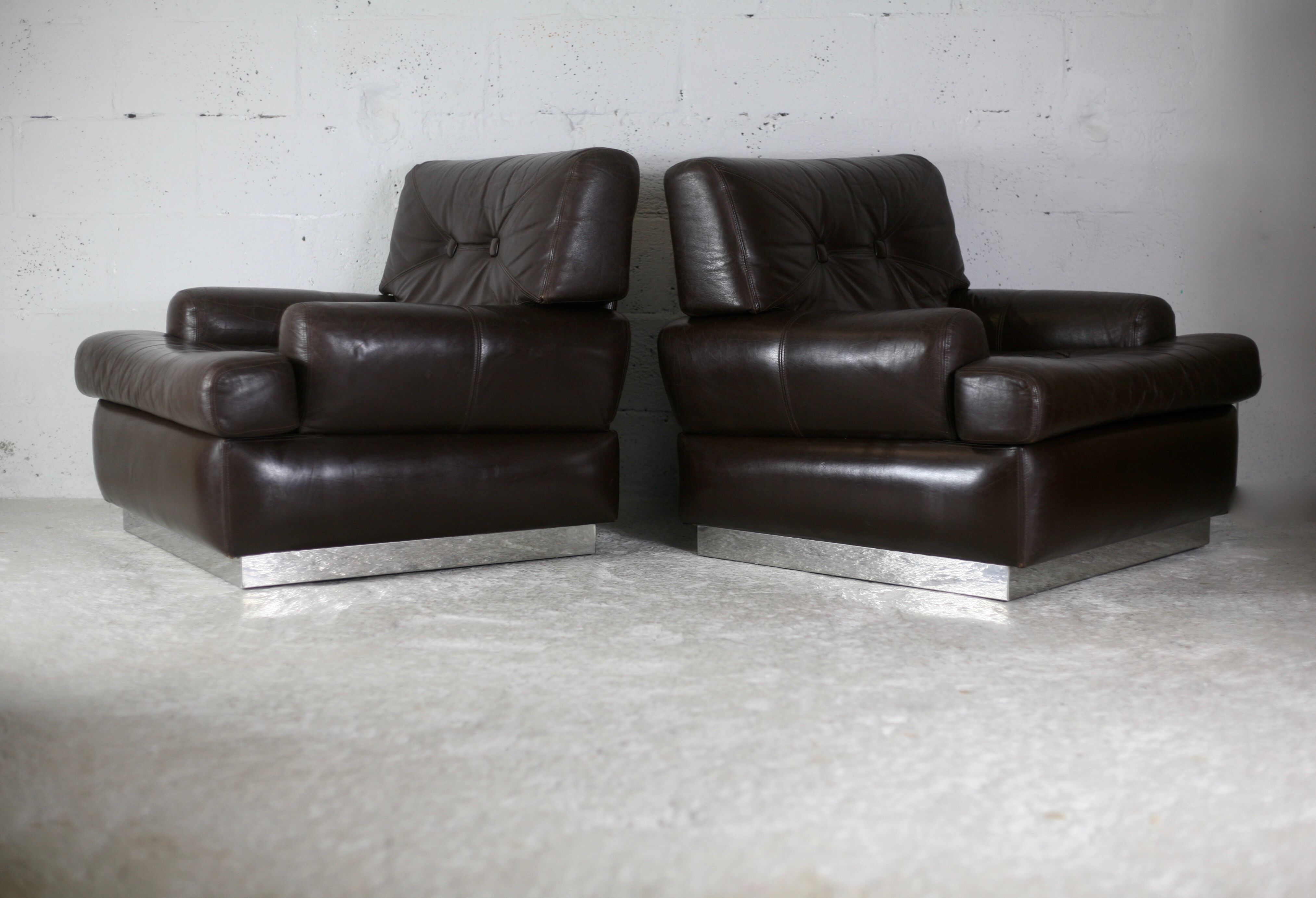 Pair of armchairs brown leather base stainless steel, France, circa 1970