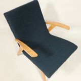 Fauteuil vintage scandinave bleu marin bouclé design moderne milieu siècle