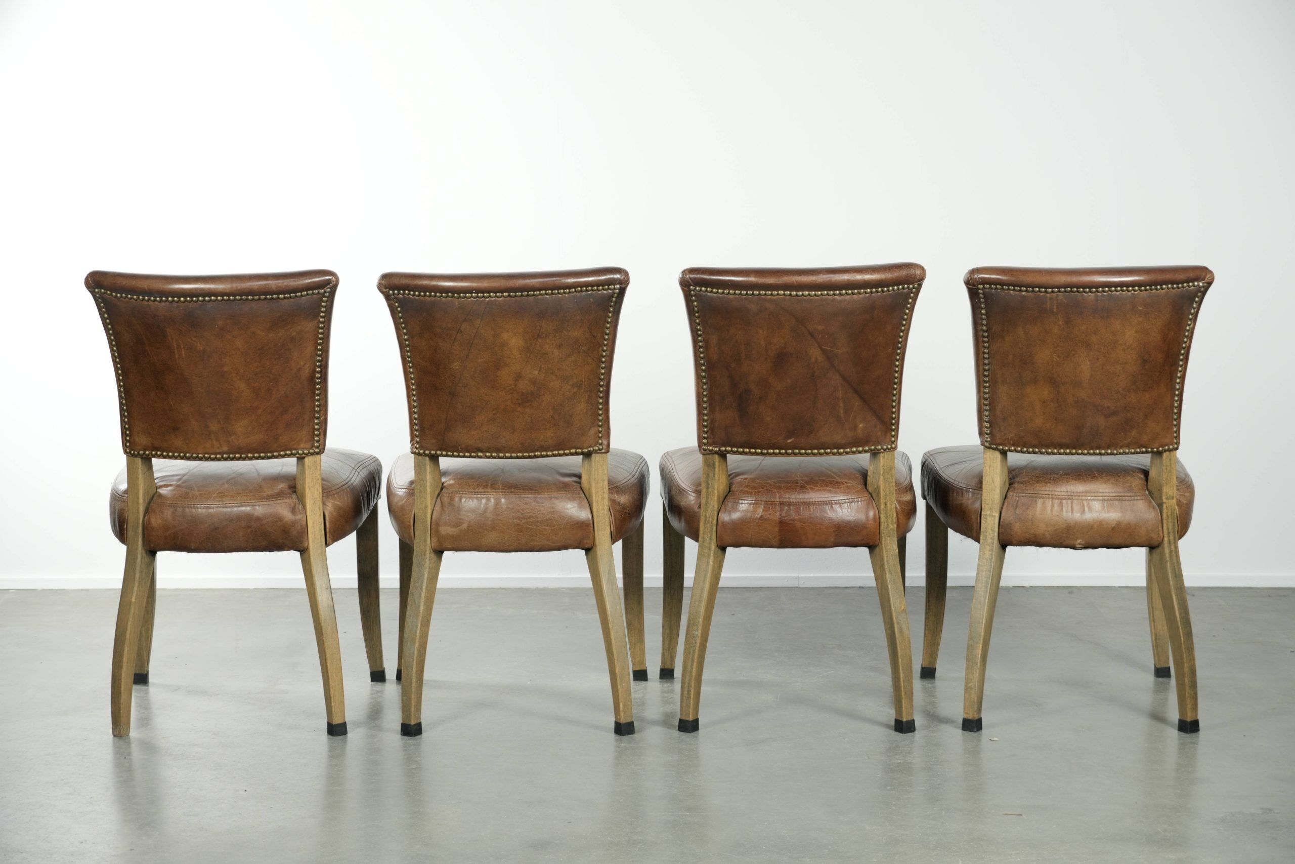 Set of 4 vintage cowhide and wooden dining chairs