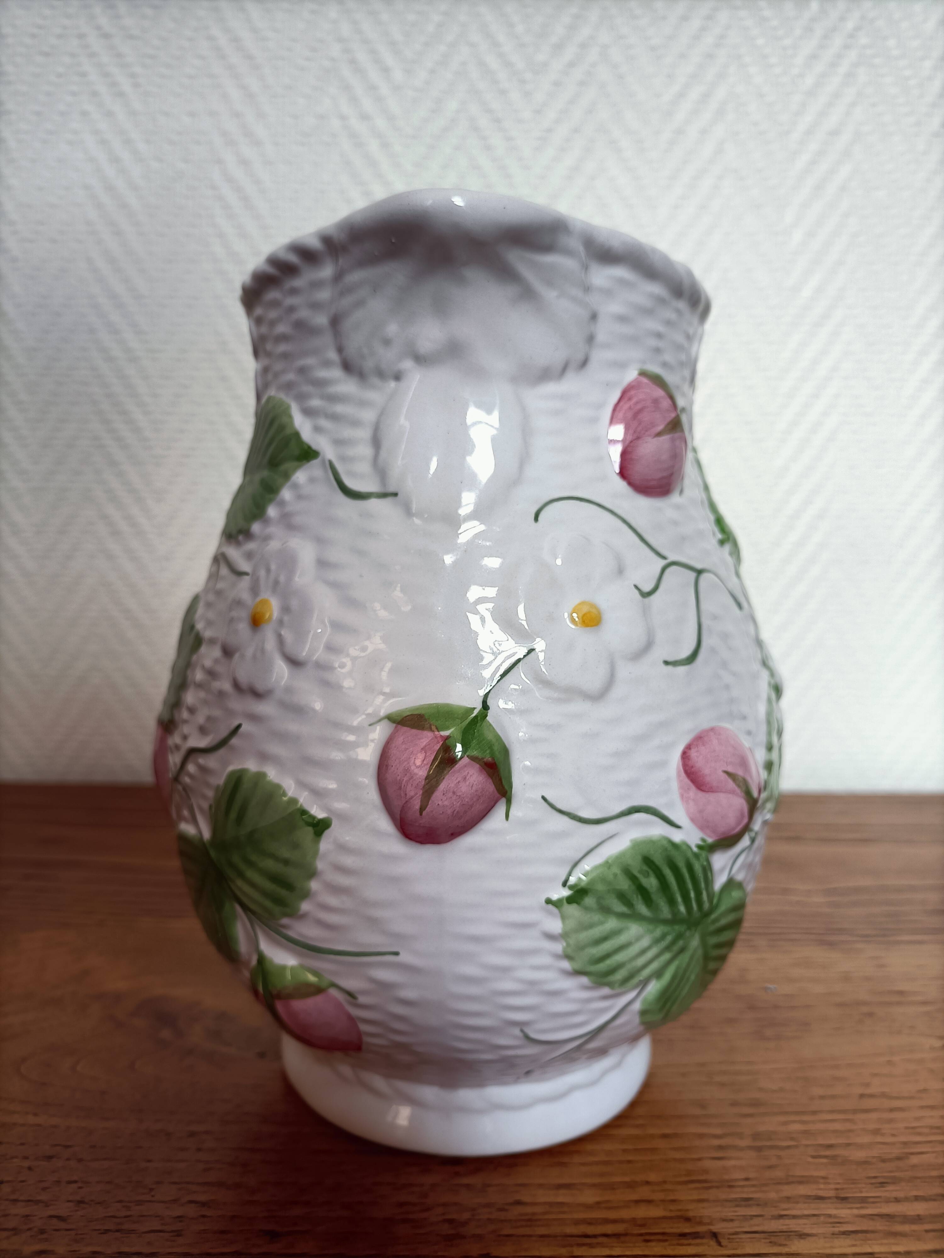 Barbotine pitcher with pastel flower decoration