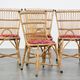 Set of 4 subtle and charming vintage 60s rattan boho chairs with colorful upholstered seats