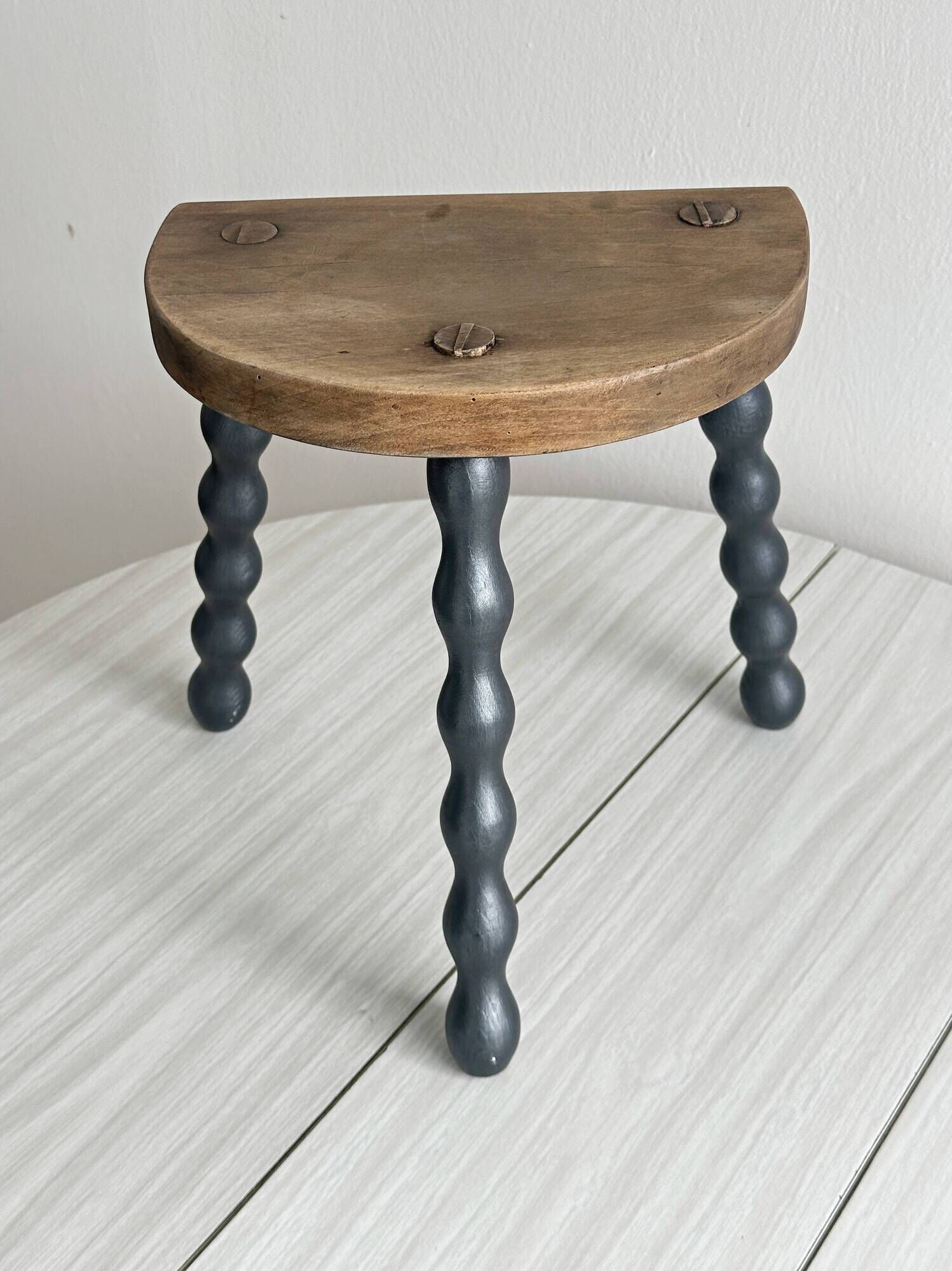 Antique wooden tripod stool with turned legs