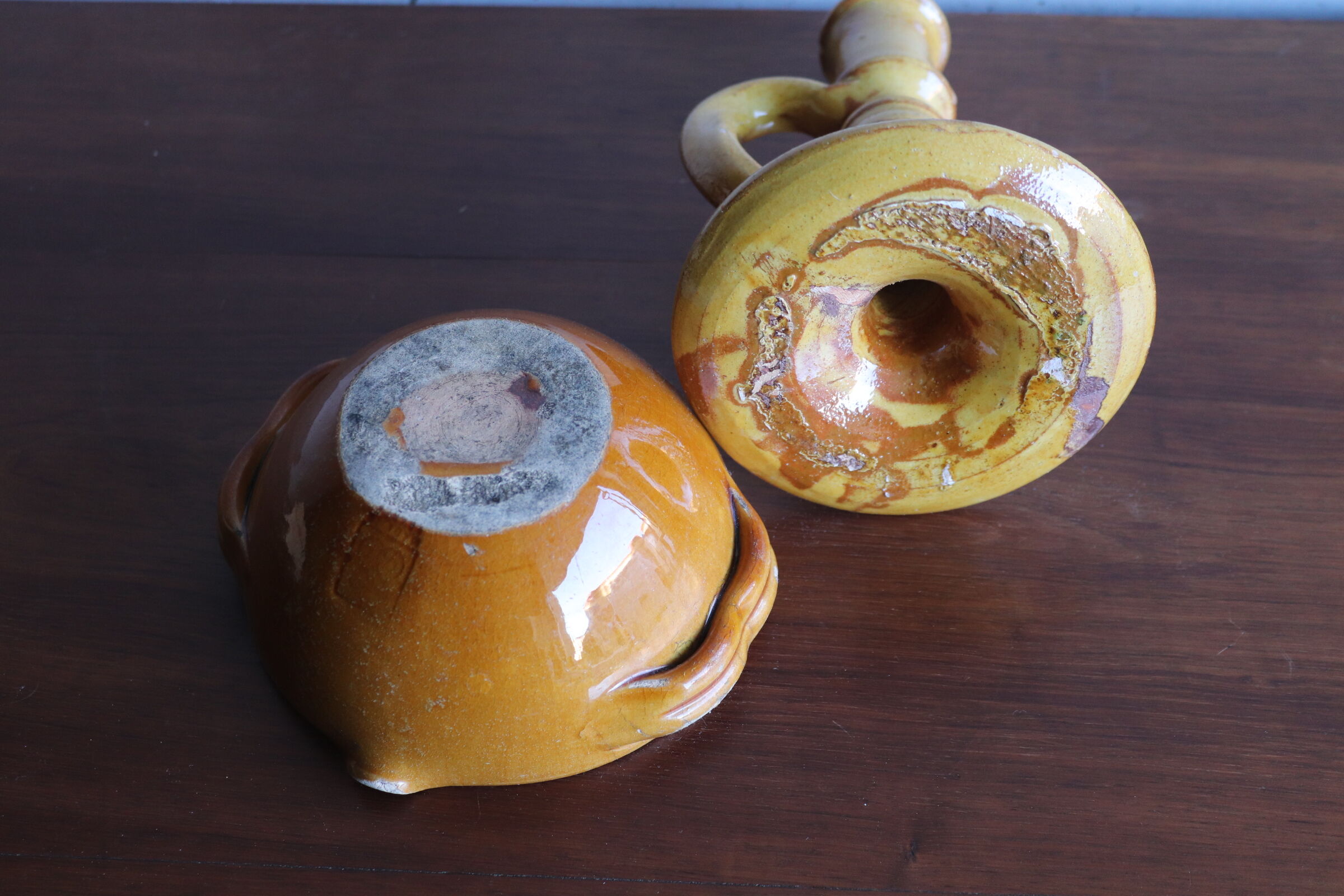 Candle holder and empty pocket in old yellow ceramic