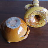 Candle holder and empty pocket in old yellow ceramic