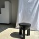 Black mango wood tripod side table with a semi-spherical top, height: 45 cm, diameter: 44 cm.