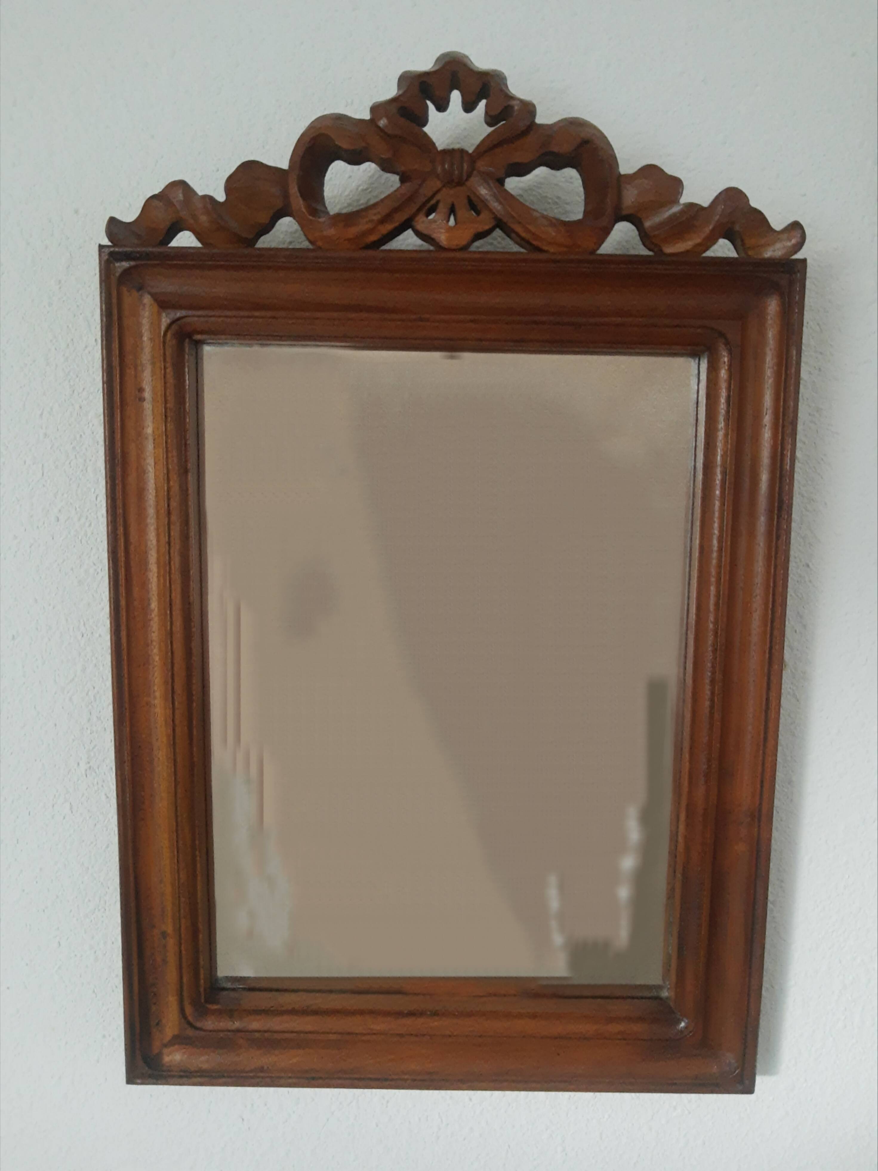 Wooden hanging mirror with vintage carved knot