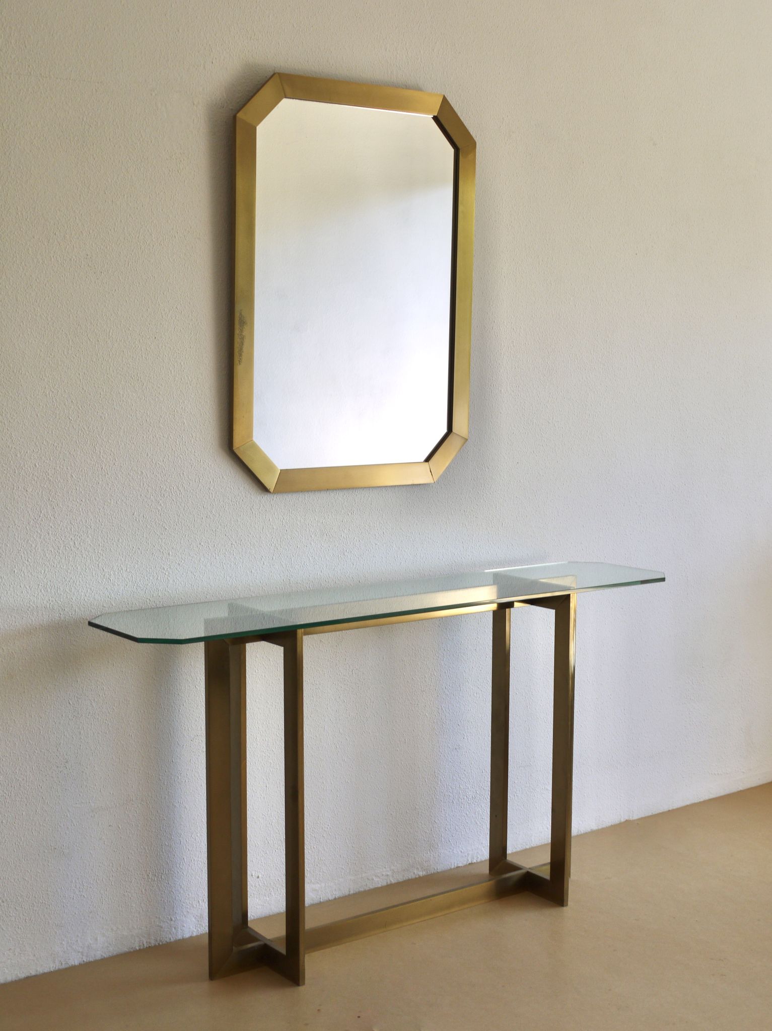 Modernist brass and glass console table & mirror. 1970s