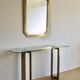 Modernist brass and glass console table & mirror. 1970s