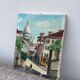 Old oil painting depicting a street in Montmartre