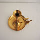 Old candlestick with brass extinguisher.
