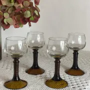 Footed glasses of the Roemer type, amber colour